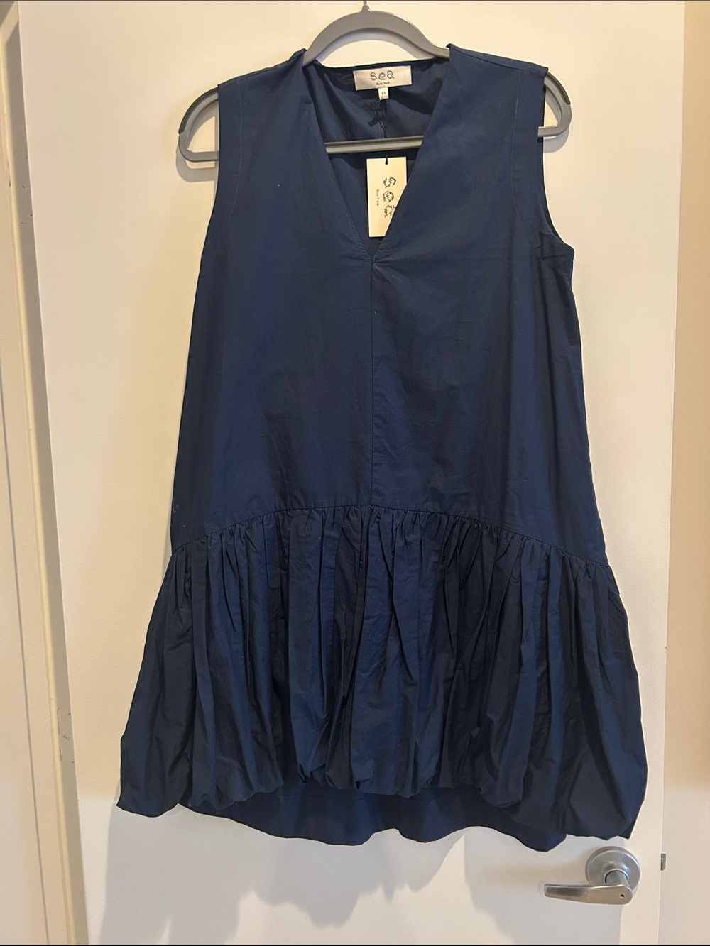 Sea navy sleeveless ruffle-hem tunic dress with pockets